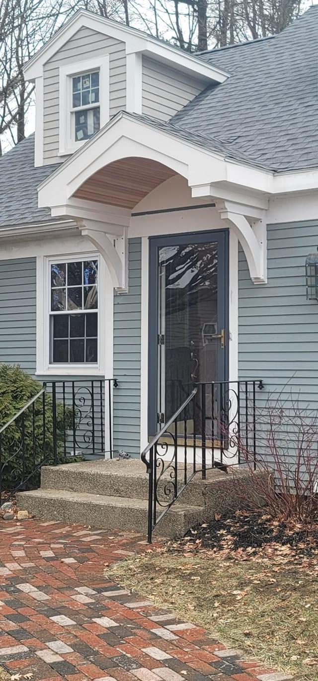 Custom exterior entry and portico by C&A Custom Builders