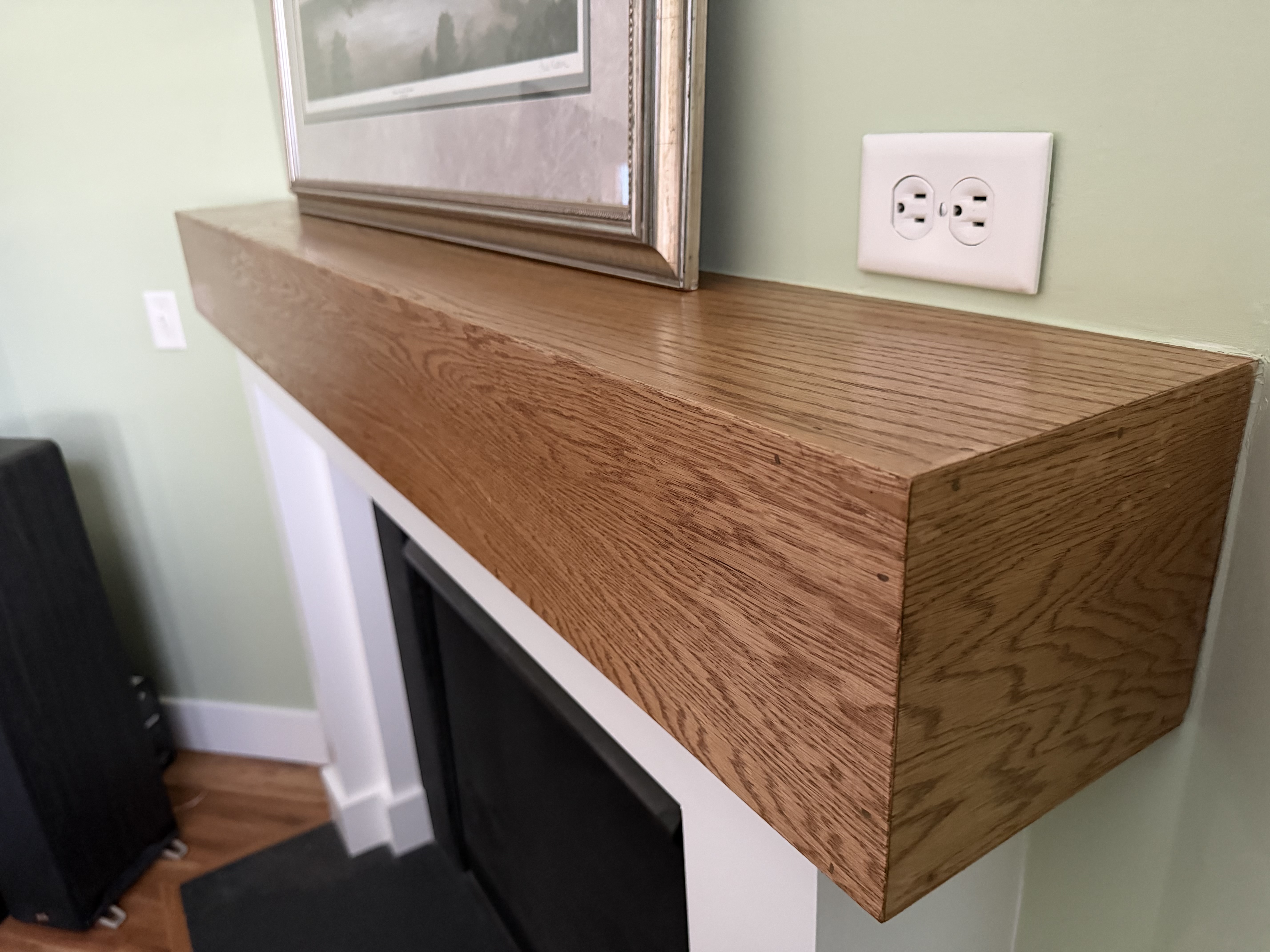 Close-up detail of custom oak mantel craftsmanship